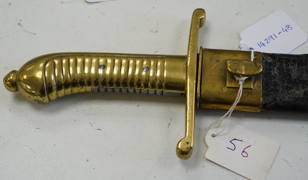An 1855 Prussian infantry pioneer’s short sword, brass hilt stamped 12.A.1.10 in its brass mounted leather scabbard, blade 47.5cm. Condition - fair, some age wear